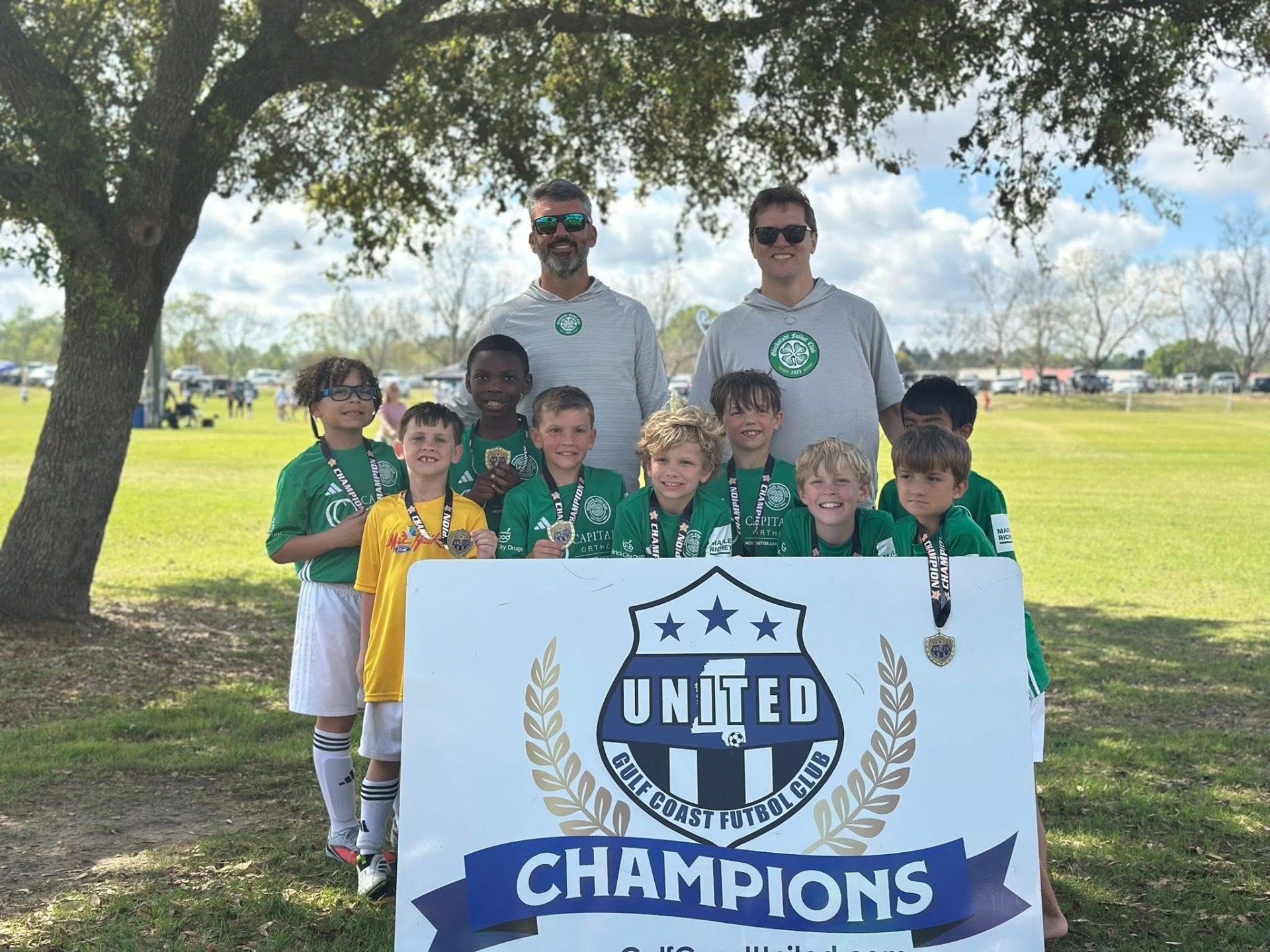Gulf Coast United Champions team photo with medals