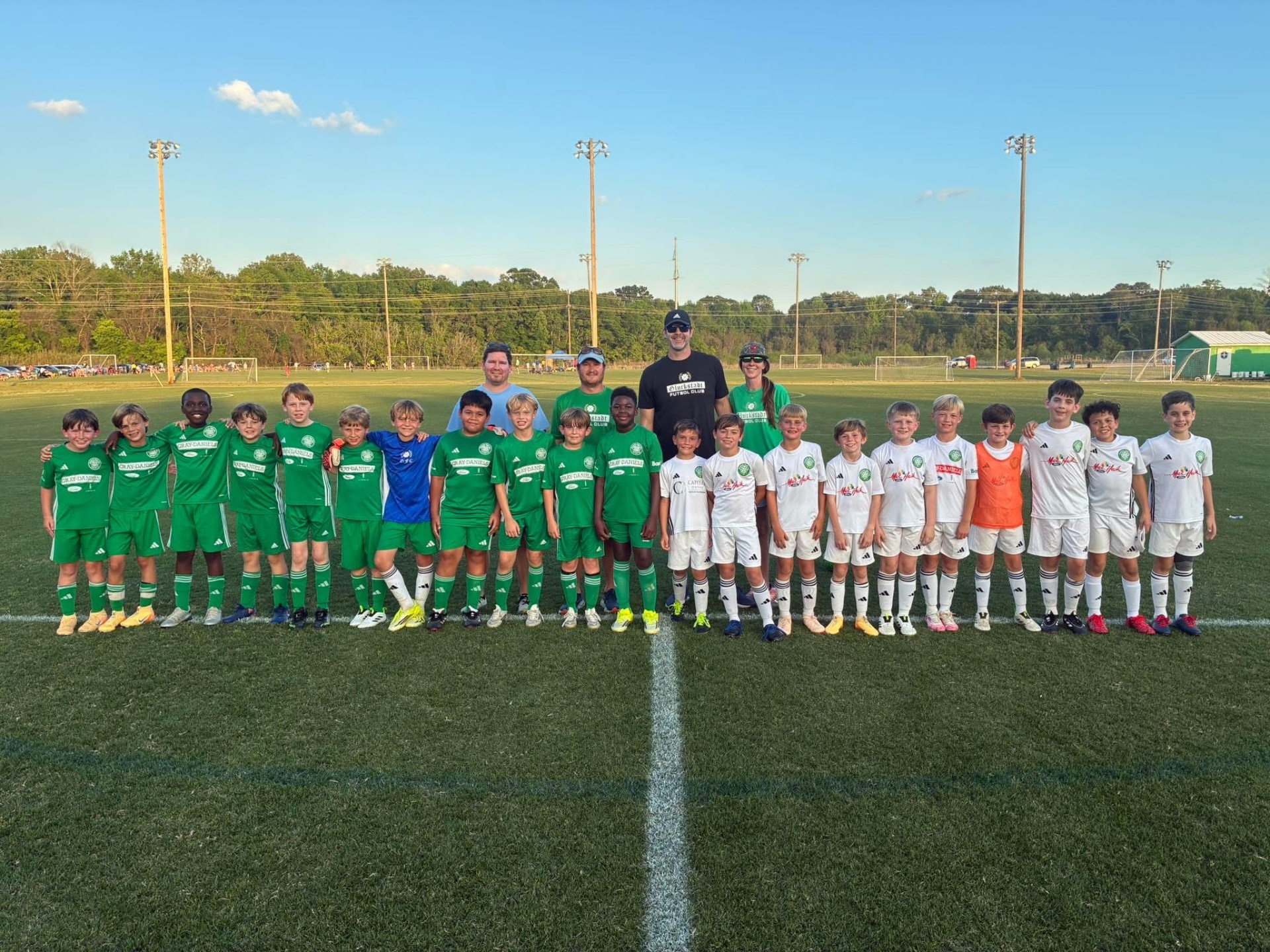 Two GFC squads side by side at midfield