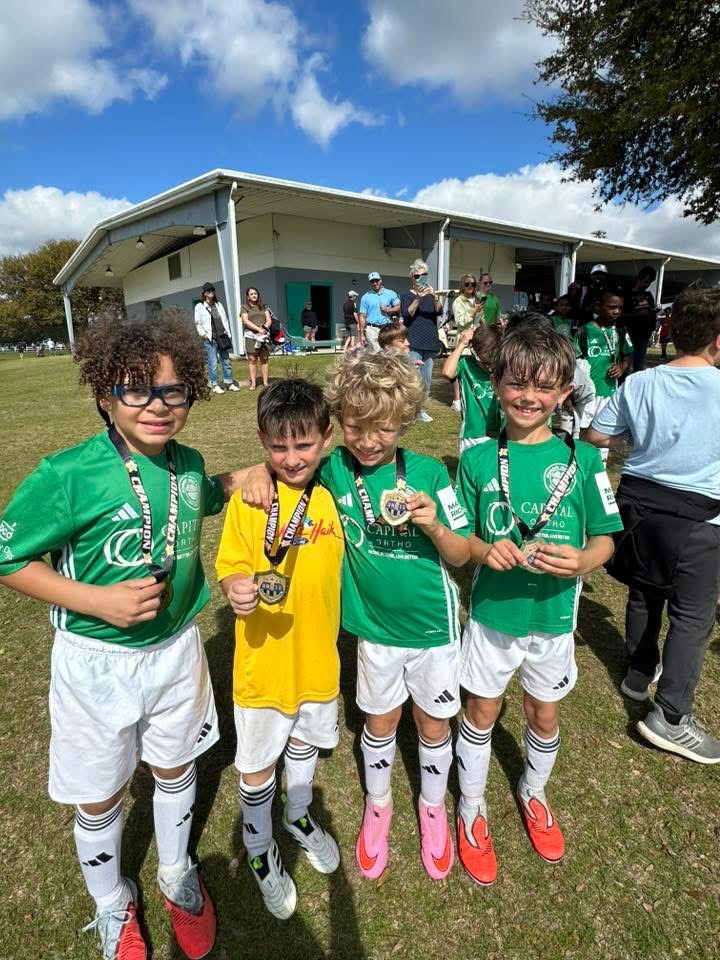 Players showing off their champion medals